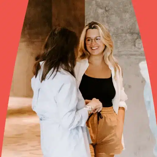 A couple of women standing and chatting
