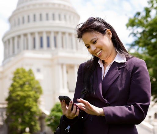Female professional looks at website rankings from Washington DC SEO company