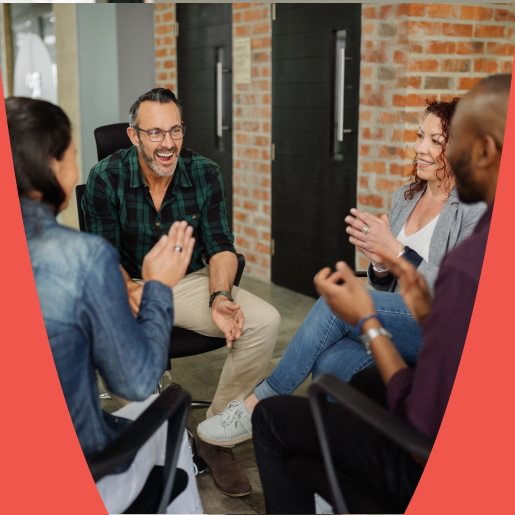 Colleagues in a relaxed setting possibly sharing feedback or brainstorming service SEO strategies.