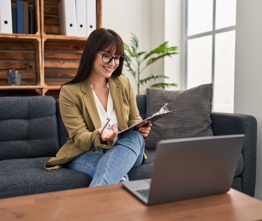 a therapist researching a healthcare seo ageny on a laptop