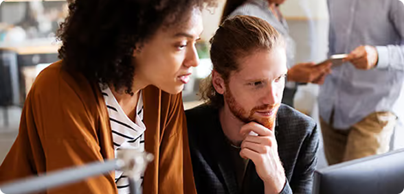 two coworkers look at impact of SaaS SEOO on demo request numbers