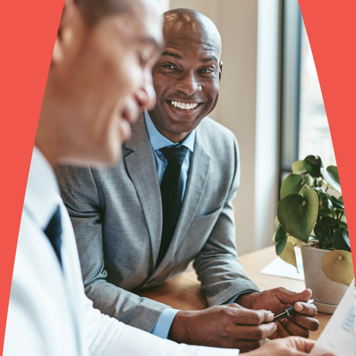 Two SEO strategists discuss keyword strategies for enterprise California clients in their San Francisco office.