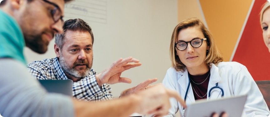 hospital administrators and staff discussing the performance of their healthcare seo agency