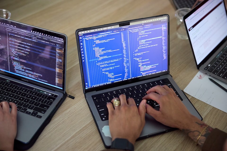 laptop with a blue screen and code