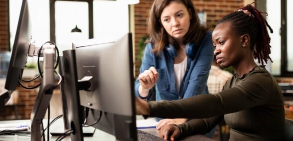 Coworkers look at AEO services impact on their business