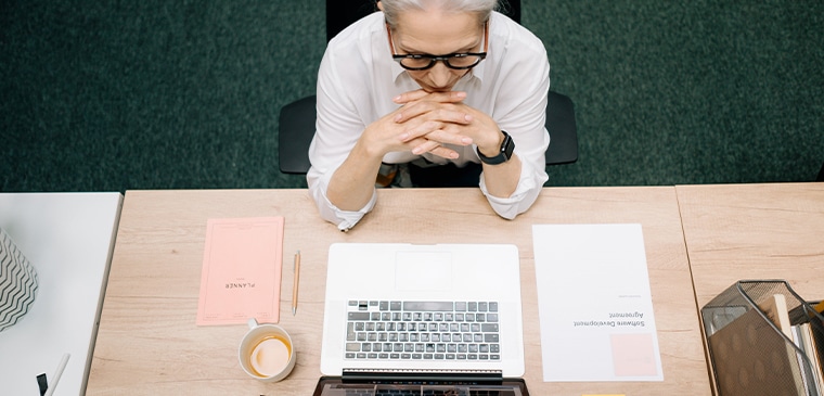 woman reads the audit findings from her technical SEO agency