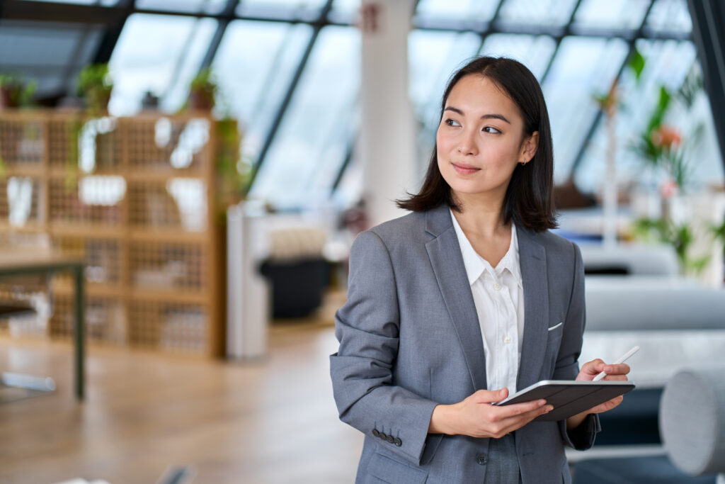 A woman in an office wonders how does enterprise SEO differ from other SEO?
